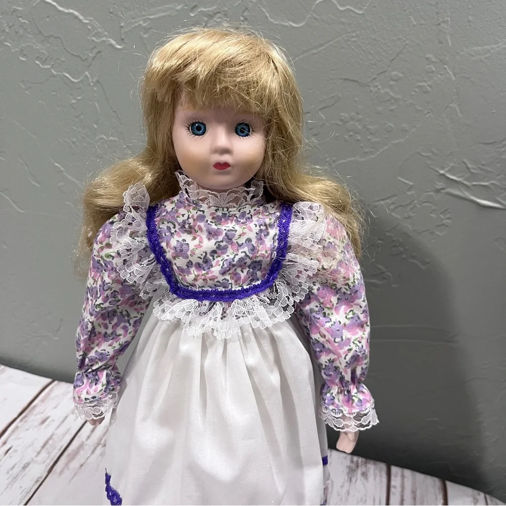 Porcelain Doll with purple floral dress and‎ Hat vintage
